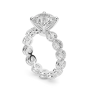 White Stone Round Shape Diamond Eternity Engagement Ring With Shared Prong Setting. 