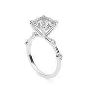 White Gold Round Shape Diamond Engagement Ring With Side Stone Prong Setting.