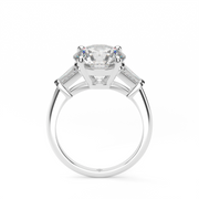  White Gold Round Shape Diamond Three Stone Engagement Ring With Channel Setting.