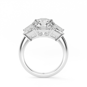 White Gold Round Shape Diamond Three Stone Engagement Ring With Trapezoid Side Stone Prong Setting
