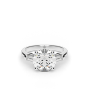  White Gold Round Shape Diamond Three Stone Engagement Ring With Channel Setting.