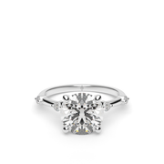 White Gold Round Shape Diamond Engagement Ring With Side Stone Prong Setting.